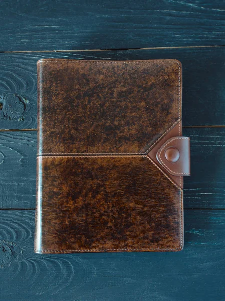 leather handmade notebook (organizer) on dark wooden background