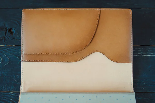 leather handmade notebook (organizer) on dark wooden background