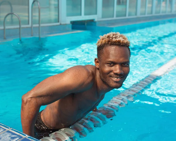African American man in swimming pool. Summer. Vacation and sport concept.