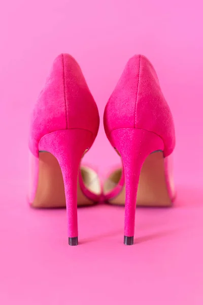 stylish pink high heels shoes on pink background. Shoes, fashion, style, shopping, sale concept