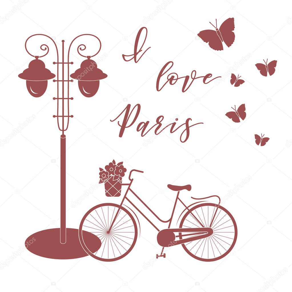 Bicycle with a basket of flowers, lantern, butterflies. The inscription I love Paris. Travel and leisure.