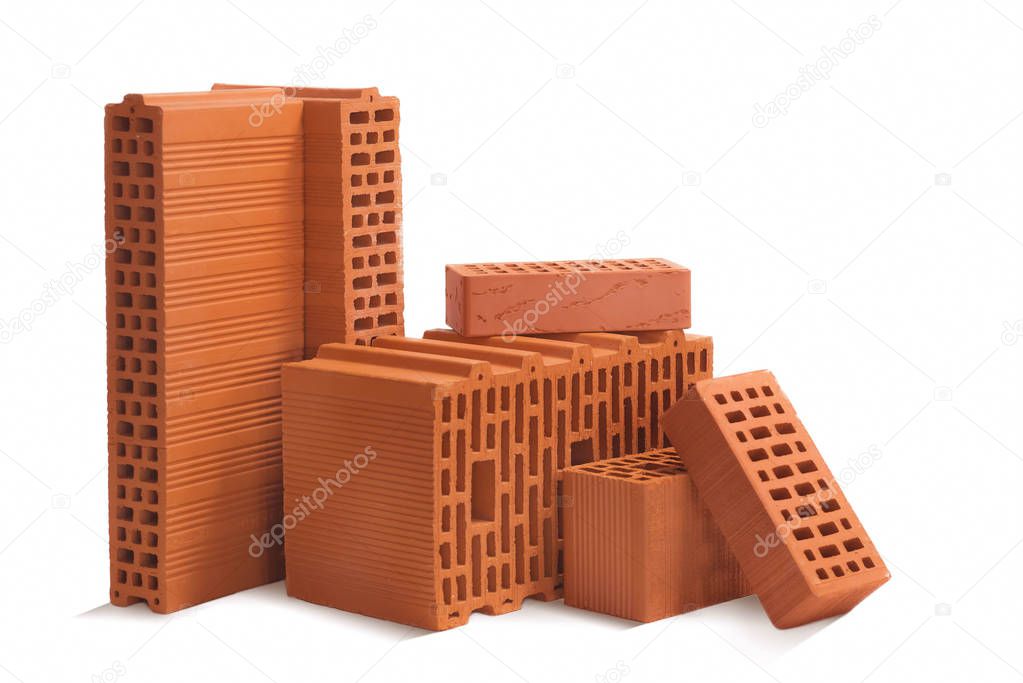 Composition of red bricks (ceramic blocks) on a white background. Ceramic blocks from a new development in the construction sector.