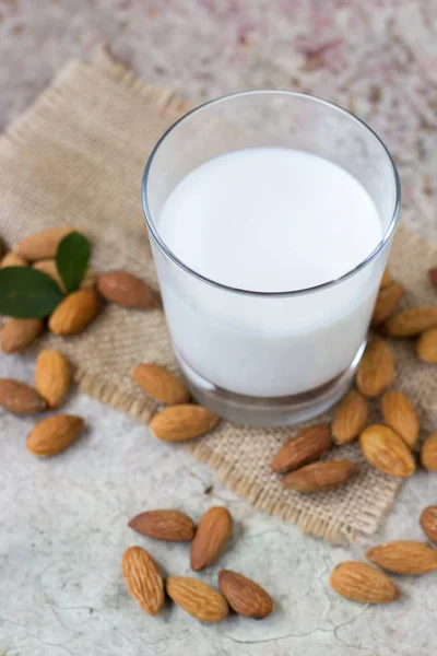 Almond milk in a glass. Organic vegan milk.