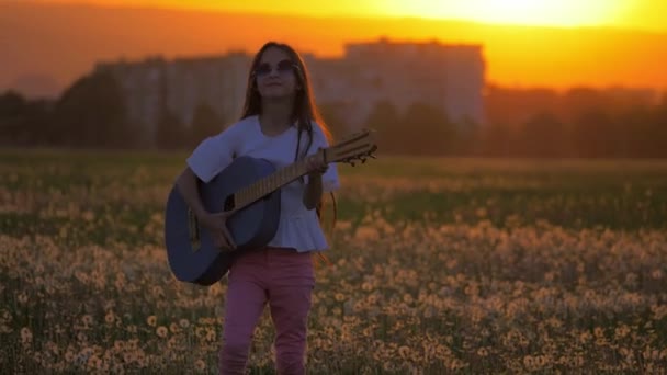 Little Girl Teenager Sunglasses Sunset Dancing Playing Guitar Standing Field — Stock Video