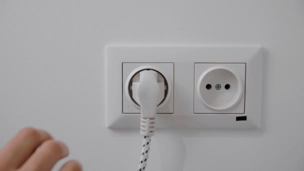 Hand pull out charger adapter into wall socket. Energy Saving Concepts and Technologies — Stock Video