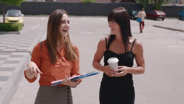 Two business people near parking business center at drinking coffee dinner break and talk. The conference, business partners 4k — Stock Video