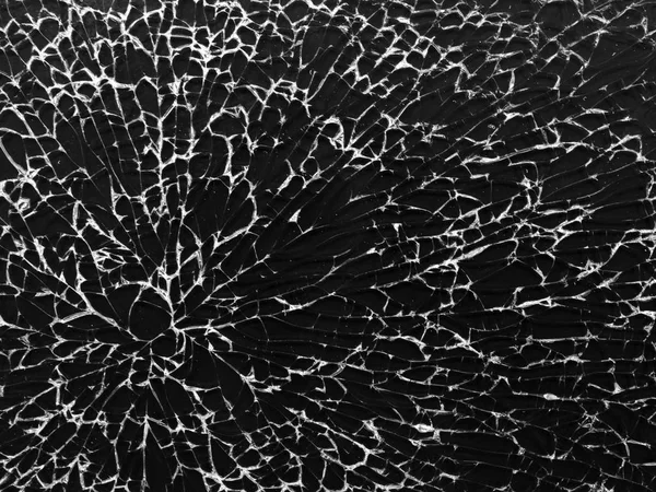 Cracked glass texture on black background. Isolated realistic cracked glass effect