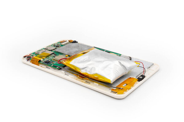 Swollen tablet battery because the battery is expired or deteriorate, ready to explode anytime. Isolated on white background