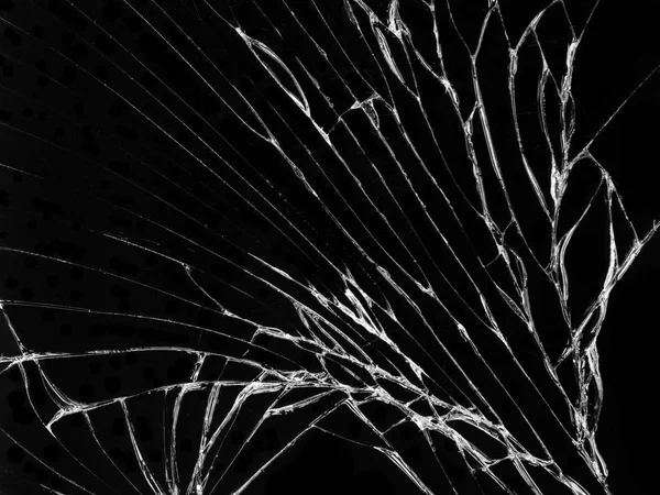 Cracked glass texture on black background. Isolated realistic cracked glass effect.