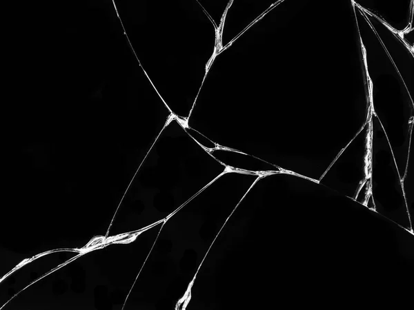 Cracked glass texture on black background. Isolated realistic cracked glass effect.