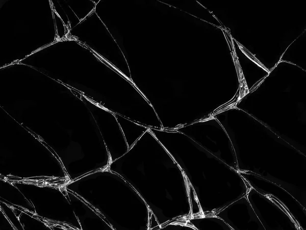 Cracked glass texture on black background. Isolated realistic cracked glass effect.