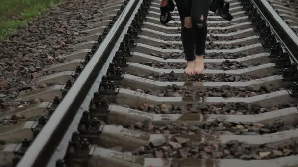 Teen girl walking barefoot on a train — Stock Video