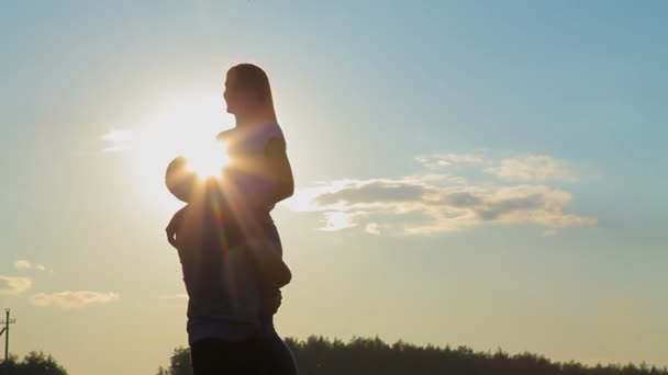 Guy circling the girl in her arms — Stock Video