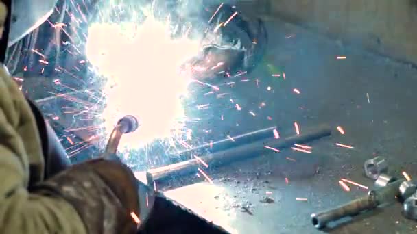 Welder at work welding a metal part — Stock Video