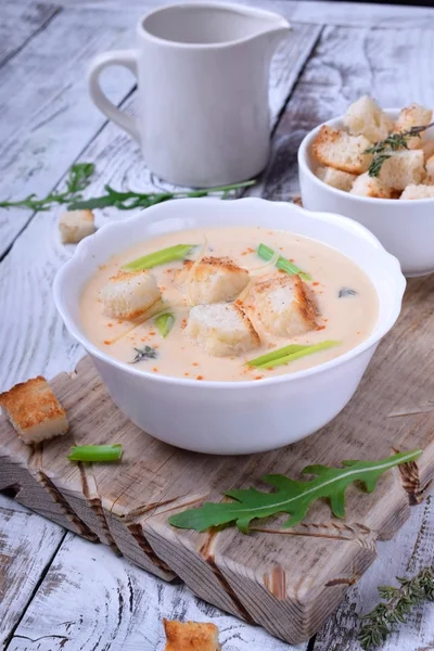 Cream soup with croutons, green onion and cheese in a white bowl — Stock Image Cream Soup Croutons Green Onion Cheese White Bowl Royalty Free Stock Images