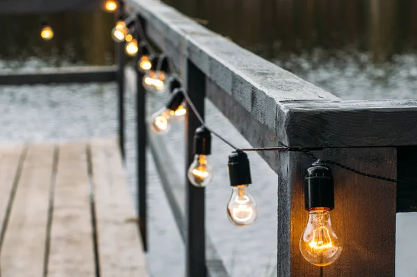 Wedding decorations, retro light garland outdoors