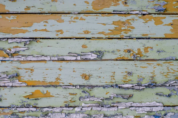 Multicolored bright old planks with cracked paint — Stock Photo, Image