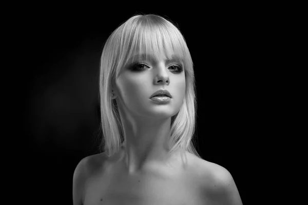 Black and white frontview of blonde model with opened shoulders. Royalty Free Stock Images