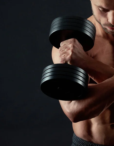 Cropped photo of athletic man keeping dumbbells — Stock Photo, Image