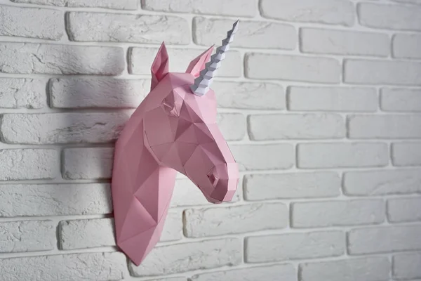 Pale pink colored unicorns head, made of paper. — Stock Photo, Image