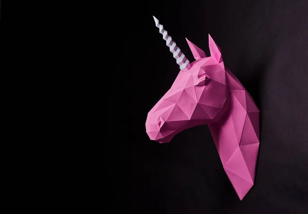 Photo of pink origami unicorns head. — Stock Photo, Image