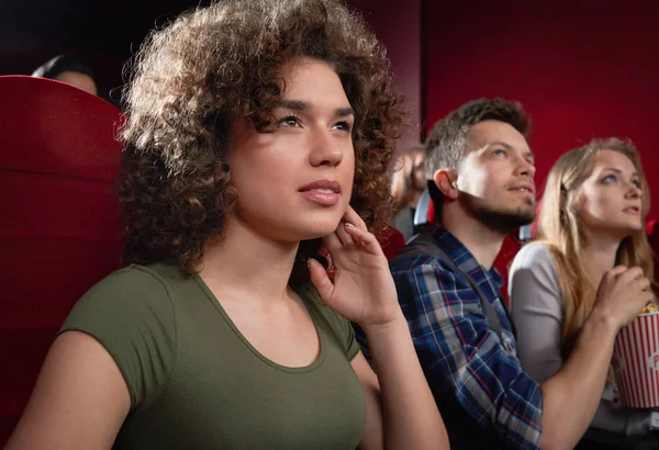 View from side of excited girl watching intriguing movie. — Stock Photo, Image