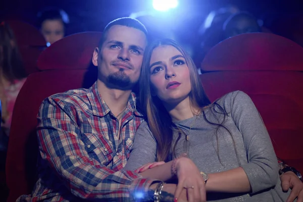 Couple  hugging in cinema.