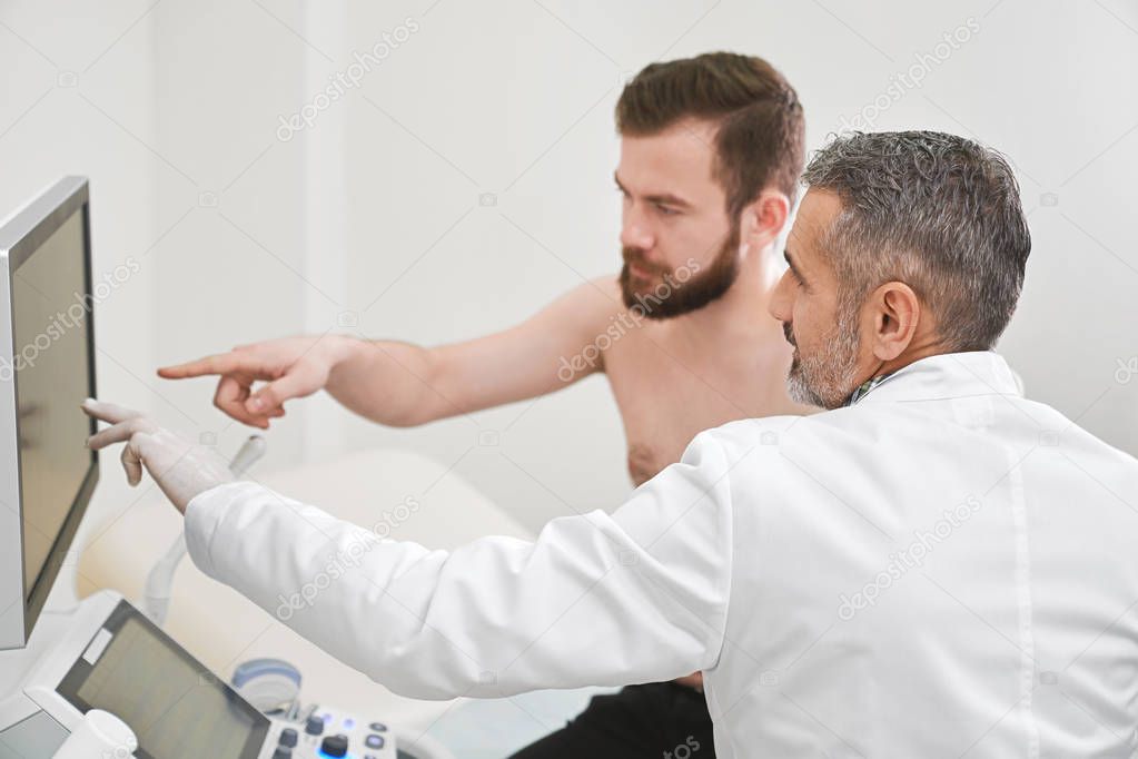 Doctor and patient consulting about results of diagnosis.