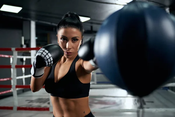 Female fighter training in boxing gloves. — Stock Photo, Image