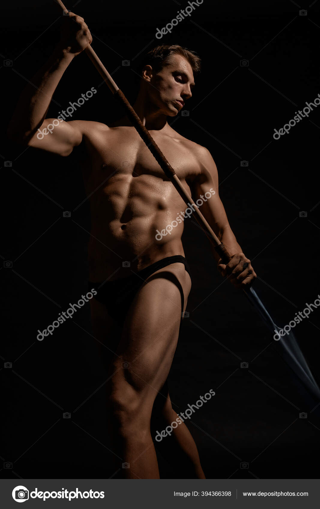 Woman holding spear Stock Photos - Page 1 : Masterfile