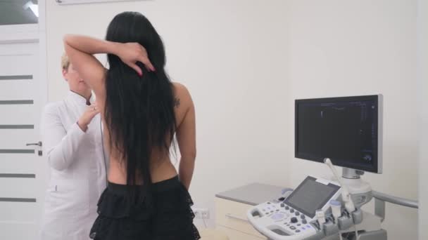 Mammologist doing breast examination. — Stock Video