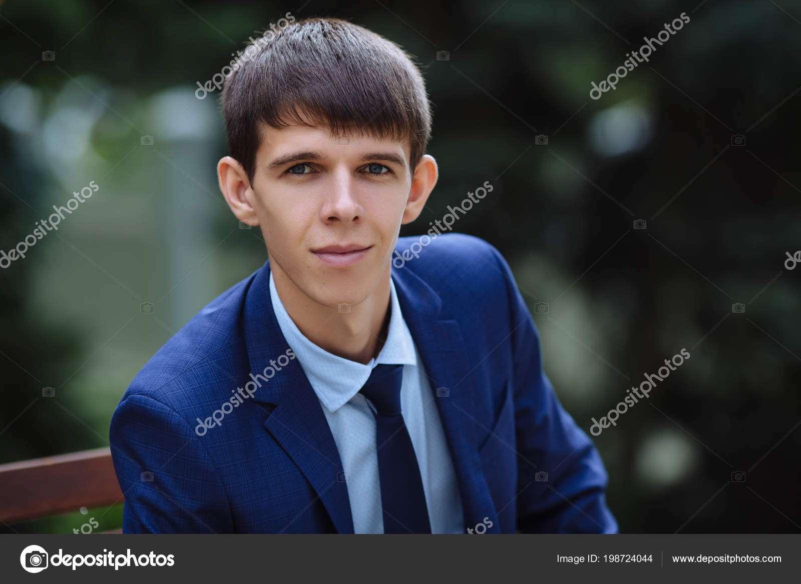 Close Up Of A Young Dark Haired Guy With Gray Eyes And Big Ears