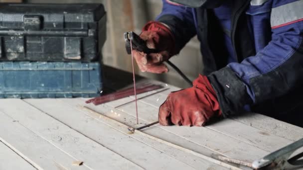 Close up welder is welding steel and iron — Stock Video