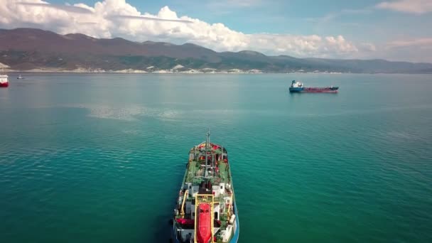 Aerial footage of tanker ship on water in sunny day, top down view — Stock Video