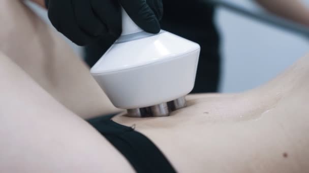 Close up, woman stomach during rf lifting therapy in medical clinic, slow motion — Stock Video