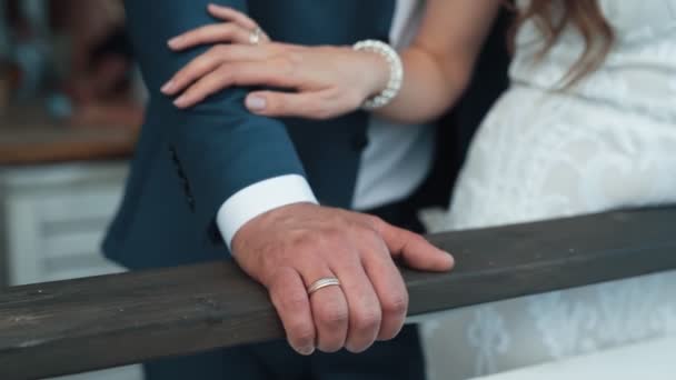 Close up hand of bride strokes hand of groom, slow motion, wedding day — Stock Video