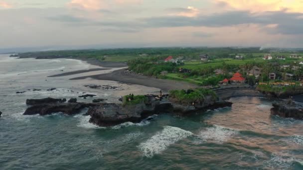 Aerial footage of black volcanic beach, green rice terraces. Bali, Indonesia — Stock Video