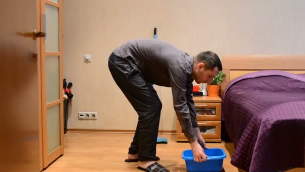 Young Man Washes Mop Floors — Stock Video