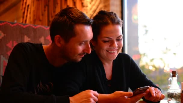 Young Couple Cafe Browsing Internet Smart Phone — Stock Video