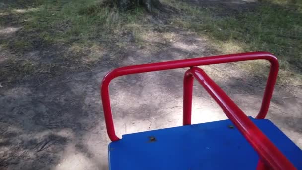 Empty playground, merry-go-round without children — Stock Video