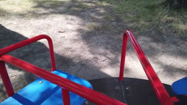 Empty playground, merry-go-round without children — Stock Video