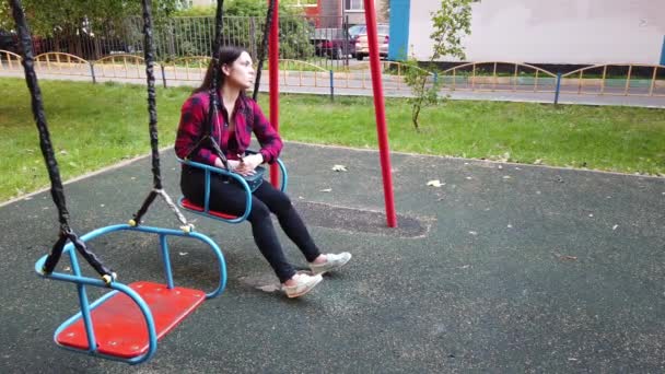 Adult Girl Playground Rides Swing — Stock Video