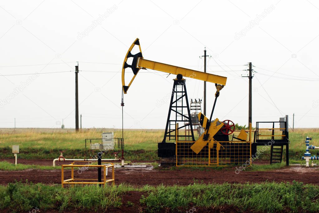 Oil pumps. Oil rocking chair. Oil industry equipment. Oil rocking chair closeup. Outdoor.