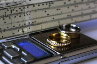 Gold ring with diamonds and a measuring instrument, the value of jewelry, object clipart