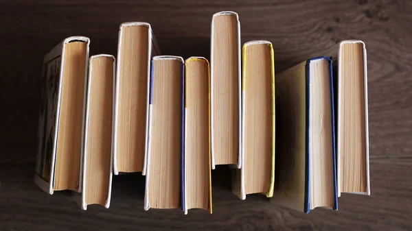 Old books on wooden table top view — Stock Photo, Image