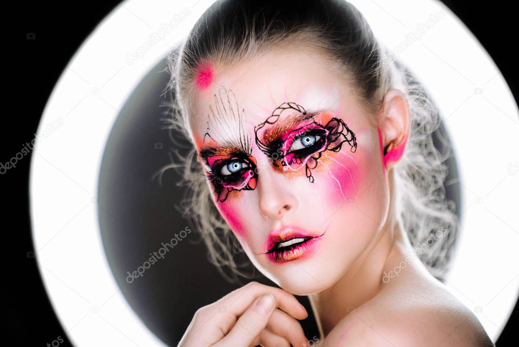 beautiful girl with art make-up clown