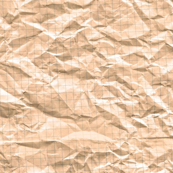 Squared paper sheet background. Creased paper grid sheet background. Old yellowing paper. Old notebook paper background