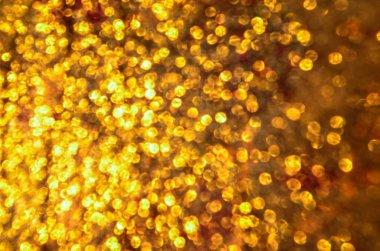 Noel ışıltılı bokeh arka plan yıldız. Altın ışıltılı toz yüzey.