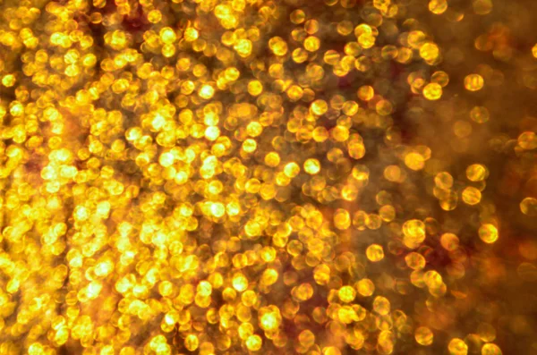 Noel ışıltılı bokeh arka plan yıldız. Altın ışıltılı toz yüzey.
