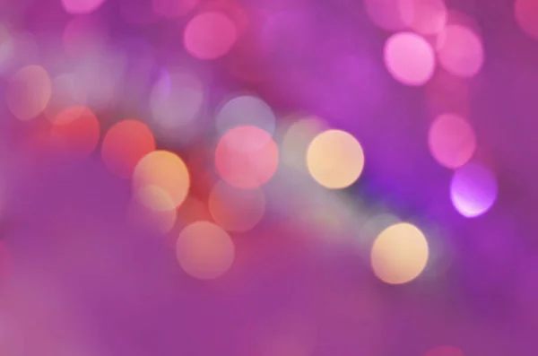 Purple glitter background, bokeh effect. Violet abstract circular bokeh